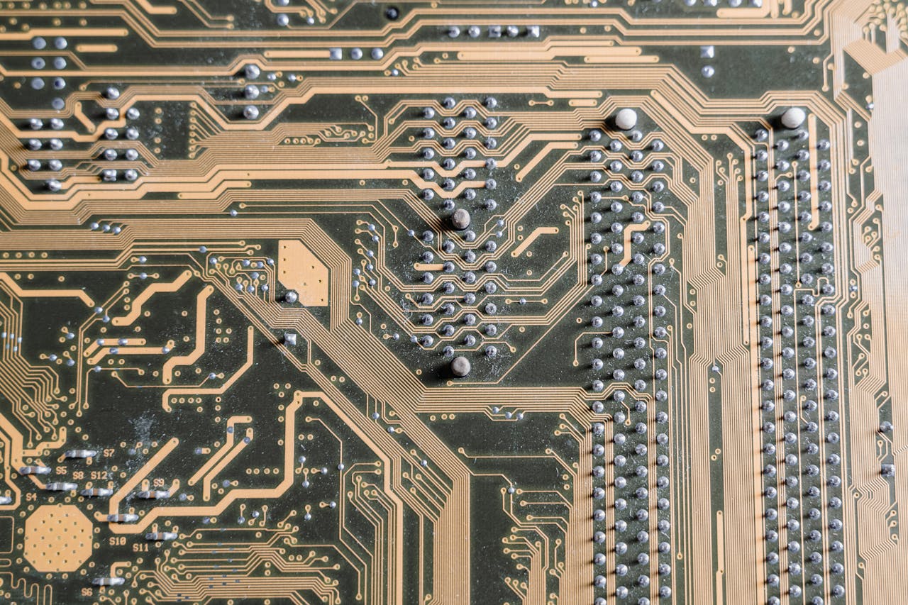 Detailed view of intricate circuitry on a computer motherboard.